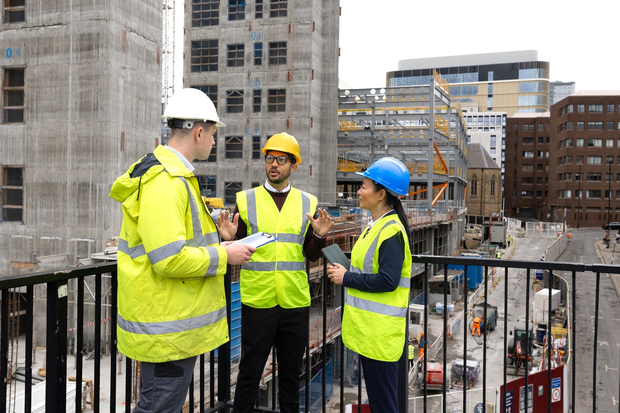 Installation team reviewing plans on site