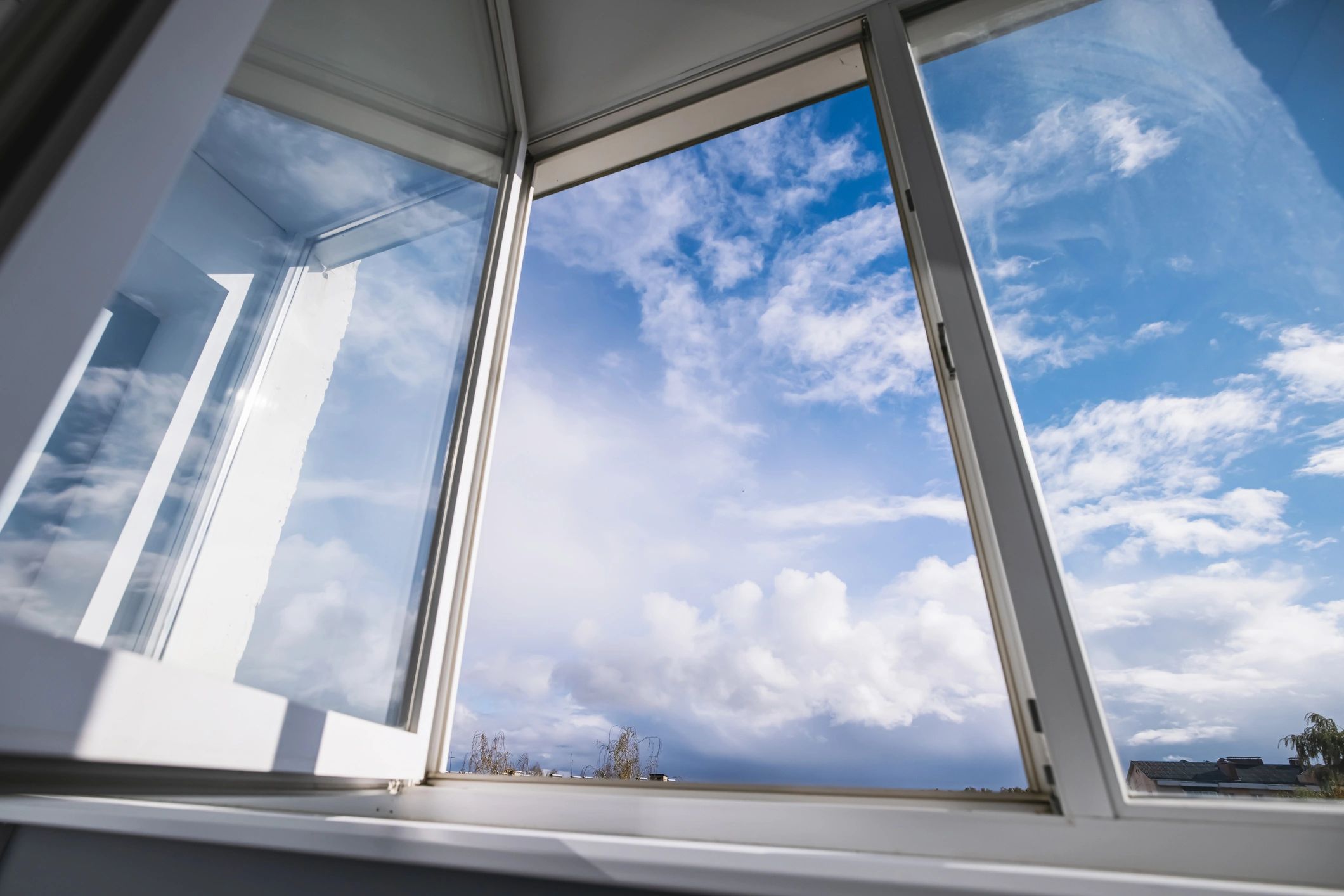 Open window with bright sky outside